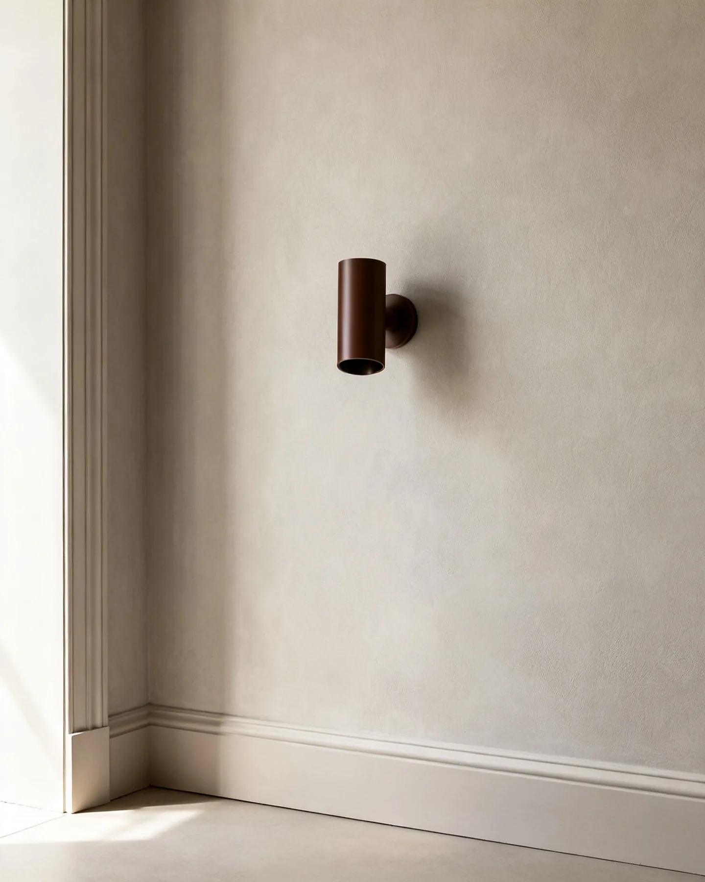 The Bolster in coffee bean lacquer, wall-mounted in daylight with the light switched off