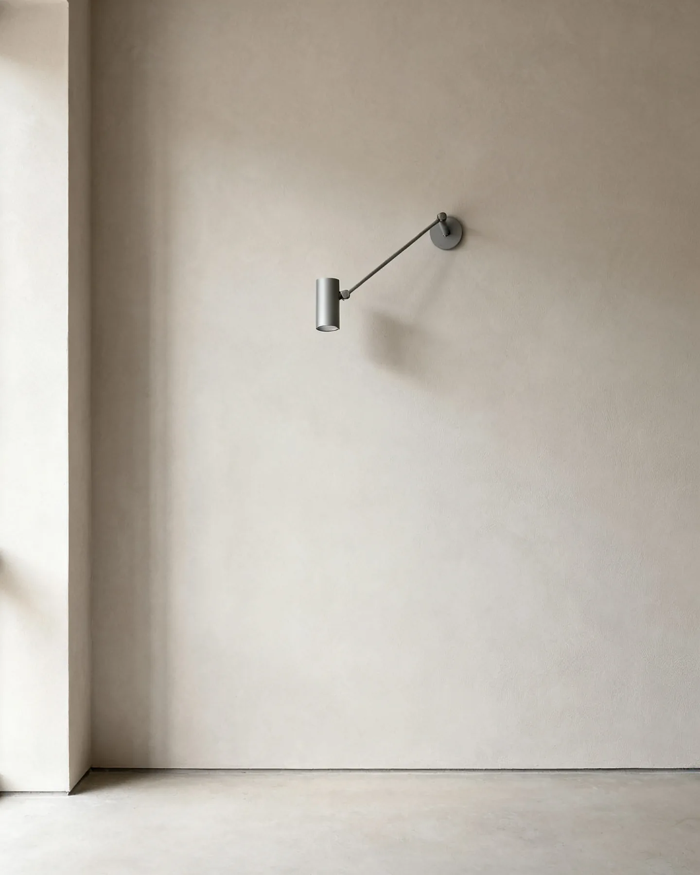 The Quarterlight in alabaster anodised aluminium, wall-mounted in daylight with the light switched off