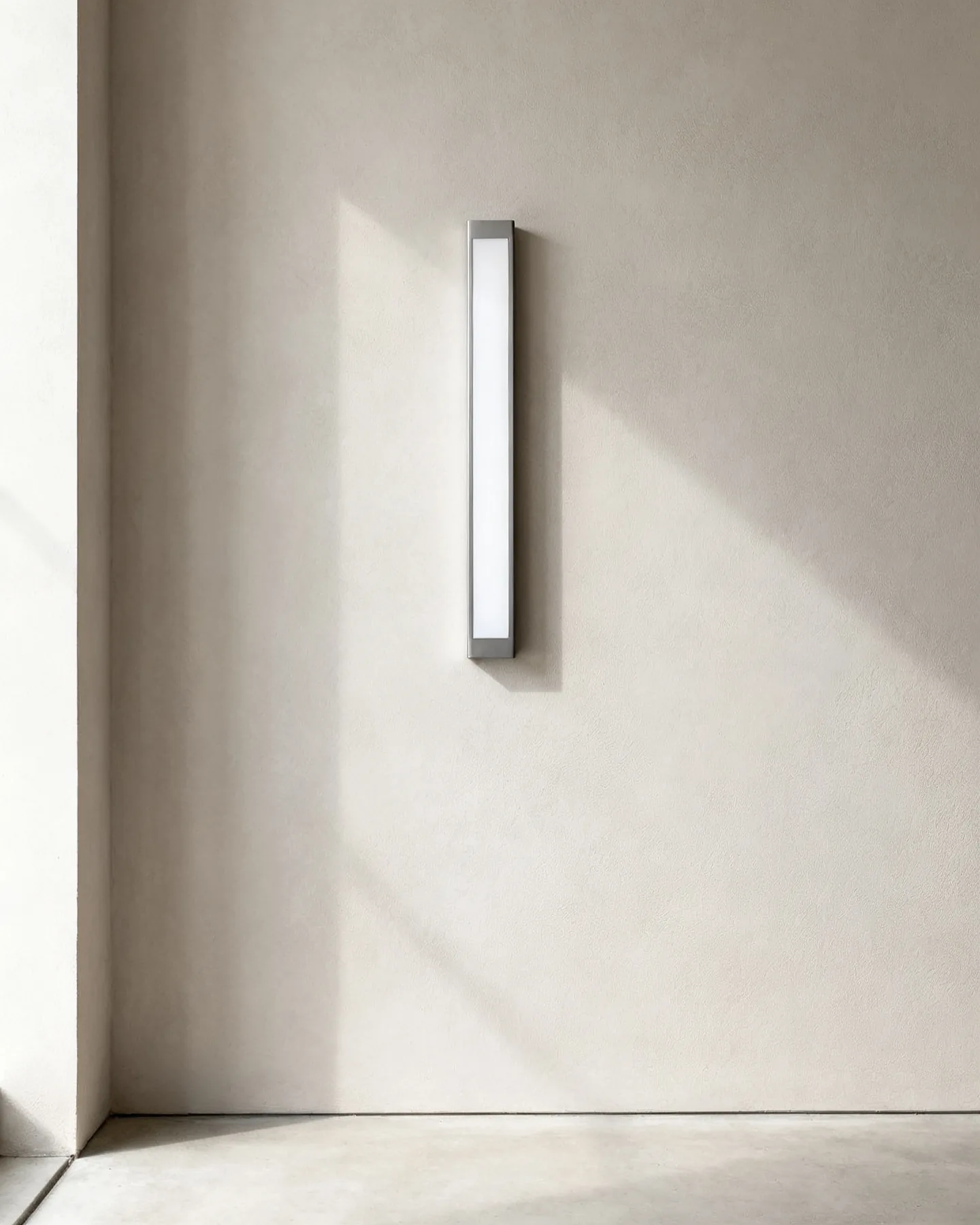 The Welt 300 in alabaster anodised aluminium, wall-mounted in daylight with the light switched off